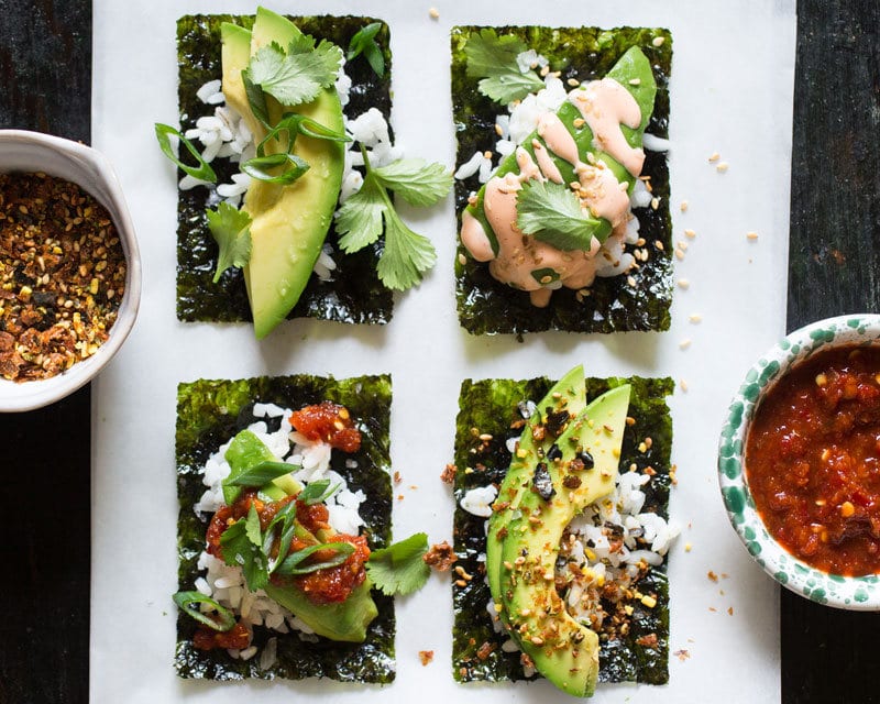 four types of avocado sushi snacks next to each other