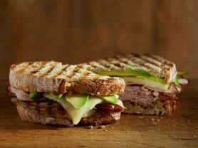 California Avocado ham sandwich cut in half