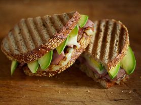 California Avocado pastrami sandwich cut in a half