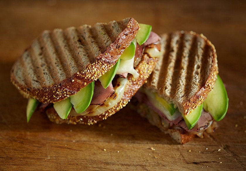 California Avocado pastrami sandwich cut in a half