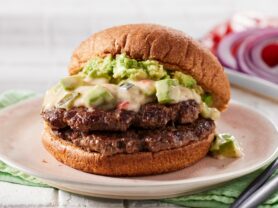A photo of a Double Smashed Avocado Burger with Hatch Chile Queso