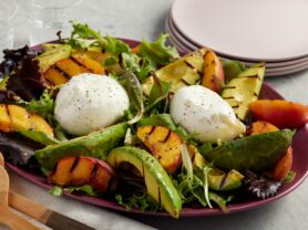A photo of a Grilled Avocado, Peach and Burrata Salad