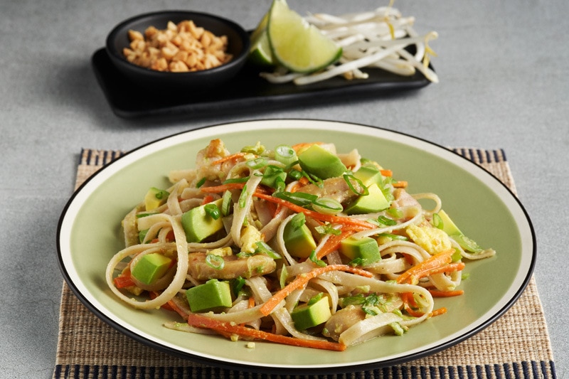main05_CAAvocado_PadthaiwithChickenandCarrots_0010.jpg Avocado chicken pad thai dish with garnishes