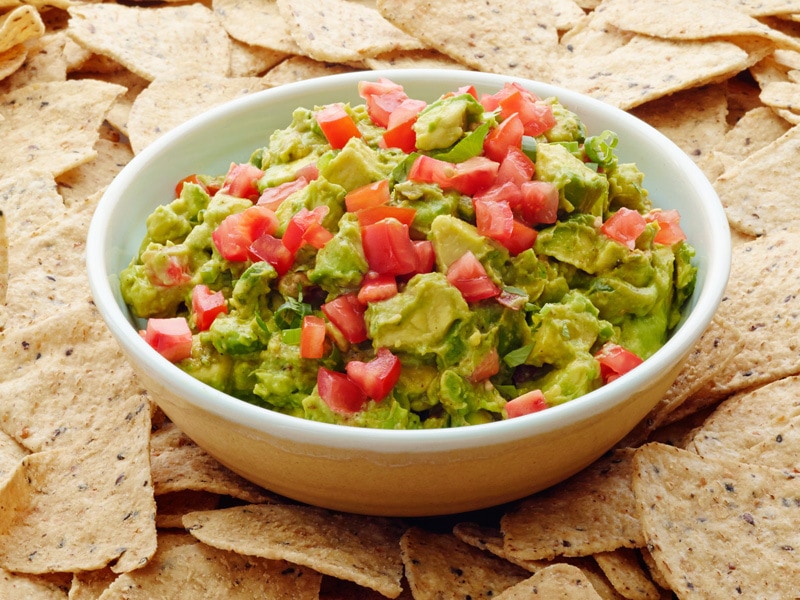 mainTomato-Studded-Guacamole-w-Scallions-Chili-FINAL-9-3-14.jpg Plate of tomato studded guacamole with scallions and chili