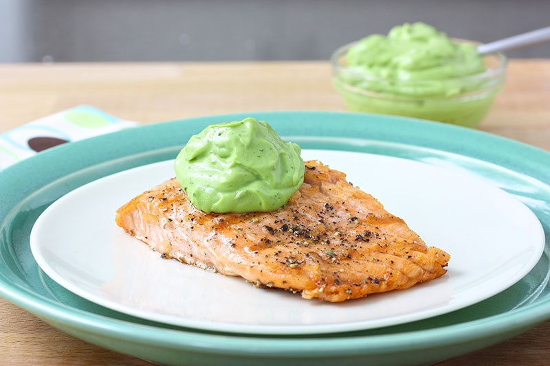 salmon-plated-with-avo-sauce.jpg Plate of salmon topped off with avocado sauce