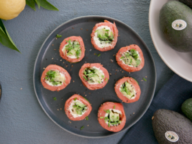 Plate of cucumber avocado smoked salmon sushi
